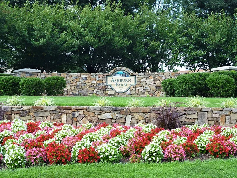 Ashburn Farms entrance and flowers to display William A. Hazel project