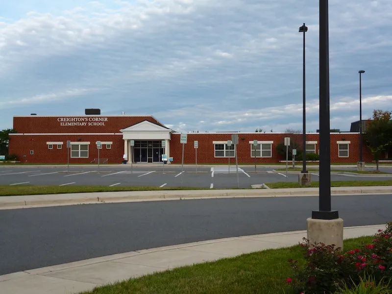 Creightons Corner elementary school building to display curb and gutter work by William A. Hazel