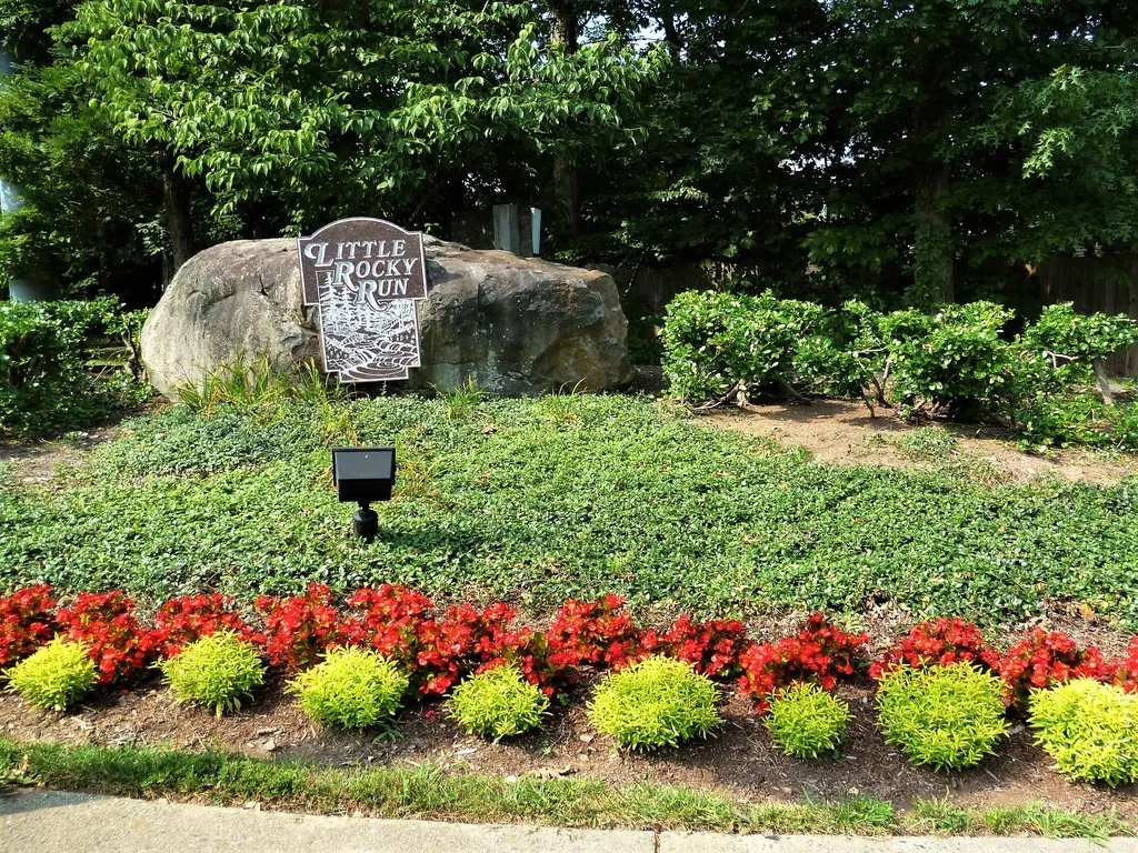 Little Rocky Run community entrance sign and flowers
