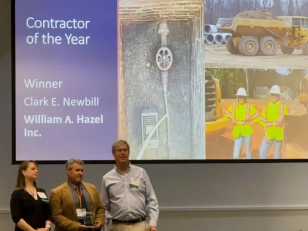 Three members of the William A. Hazel team accepting the Contractor of the Year award by APWA and DPWES 