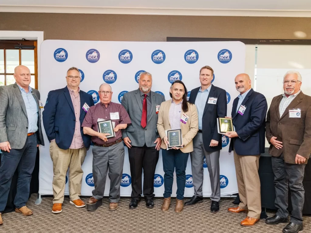 Eight employees of William A. Hazel accepting the HCCA Excellence in Infrastructure award at the award ceremony