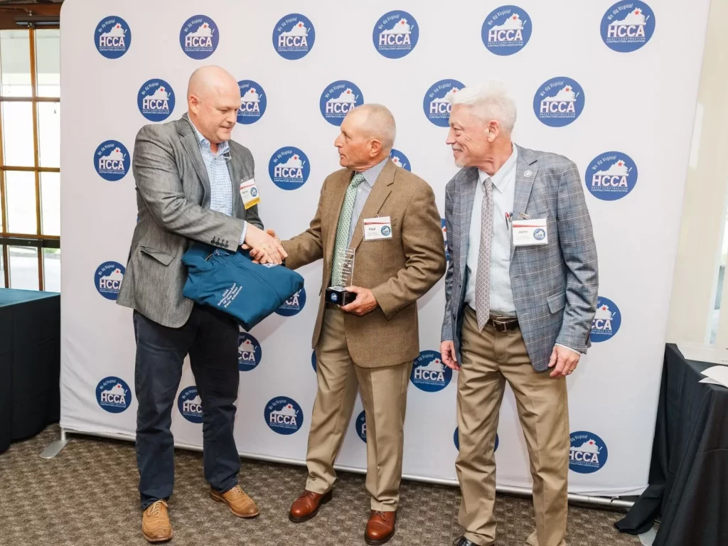 Three members of the William A. Hazel team accepting the Superintendent of the Year award including the recipient, Paul Atherton